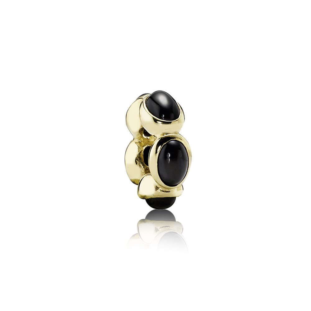 Abstract gold spacer with black onyx